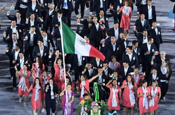 Daniela Campuzano carries the flag of Mexico during the opening ceremony for the 2016 Summer Olympics in Rio de Janeiro, Brazil, Friday, Aug. 5, 2016. (Richard Heathcote/Pool Photo via AP)